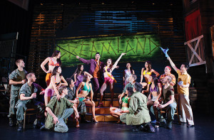 The cast of 'Miss Saigon' on the 'Dreamland' stage set at The Arts Centre Gold Coast's new musical theatre production